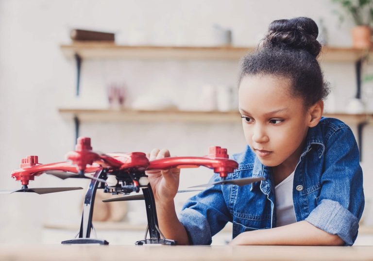 Young,Cute,Girl,Holding,Quadcopter.,Child,Playing,With,Drone,At