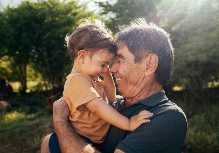 Playful,Grandfather,Spending,Time,With,His,Grandson,In,Park,On